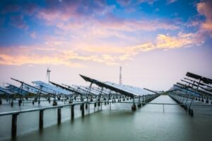 solar and wind power in sunset,green energy background